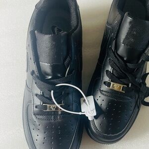 All Black Low-Top Sneakers with Gold Lace Plate